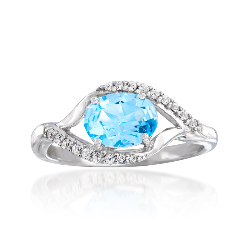 Swarovski topaz ring in sterling silver with blue oval center and white stone halo