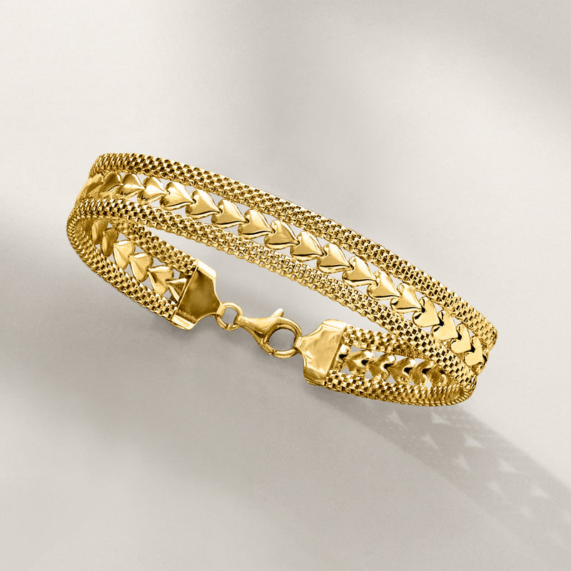 Gold over sterling silver heart-motif bracelet, open-work link pattern and toggle clasp