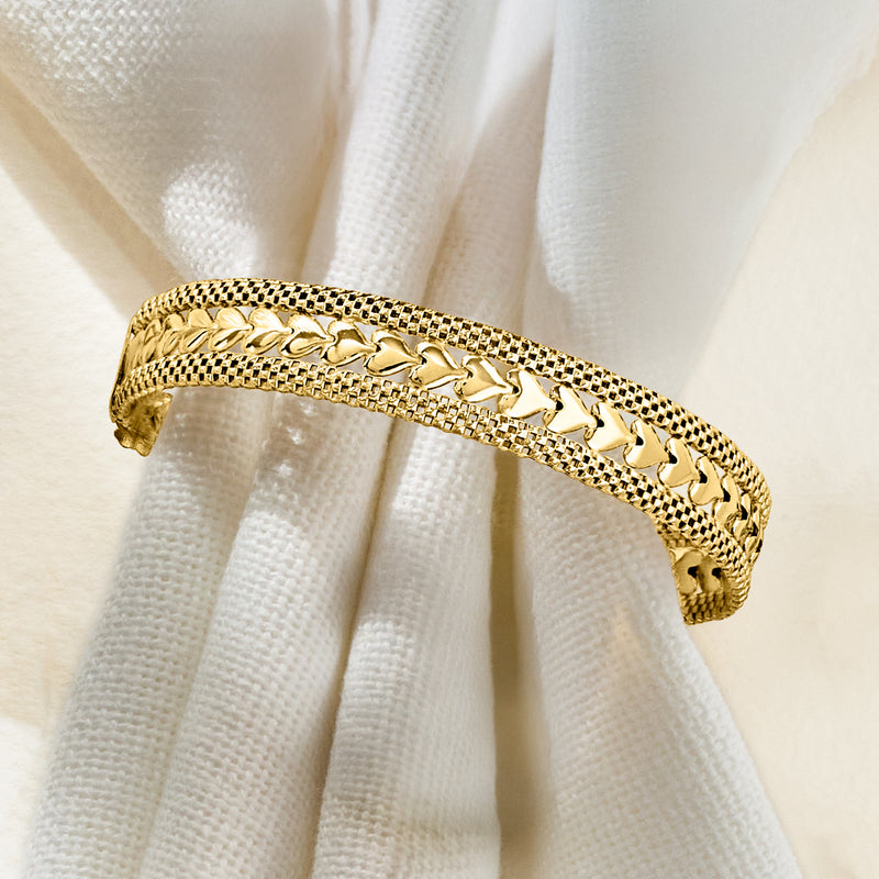 Gold over sterling silver heart-motif bracelet close-up of textured links and hearts