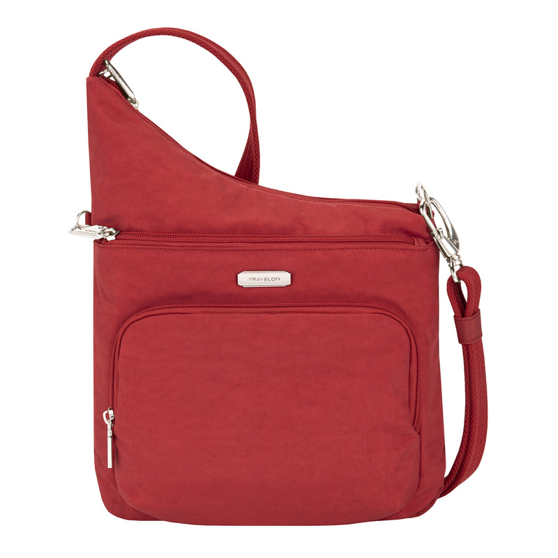 Red anti-theft crossbody bag with front zip pocket and adjustable shoulder strap