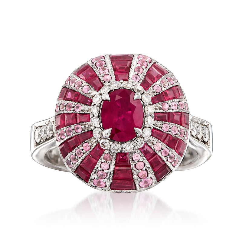 14kt white gold ring with oval ruby center, pink sapphire halo, and diamond accents