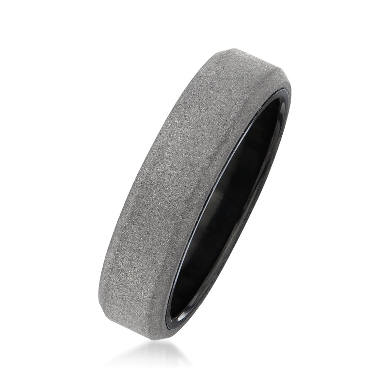 Gray tungsten carbide wedding band with brushed exterior and glossy black inner