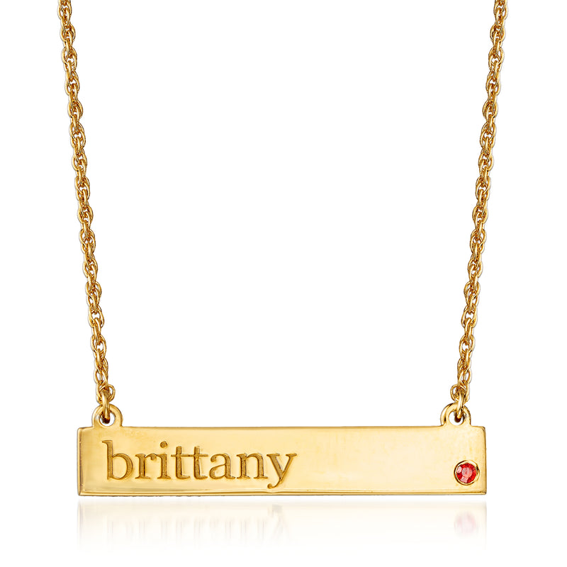 Gold personalized nameplate necklace with Brittany and red birthstone accent