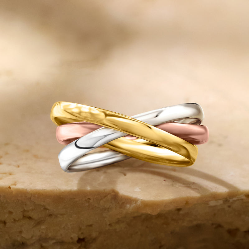 Tri-color 14k gold rolling ring in yellow, rose, and white with twisted profile