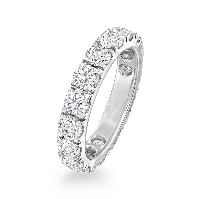 14kt white gold diamond eternity band, angled view, channel-set round stones