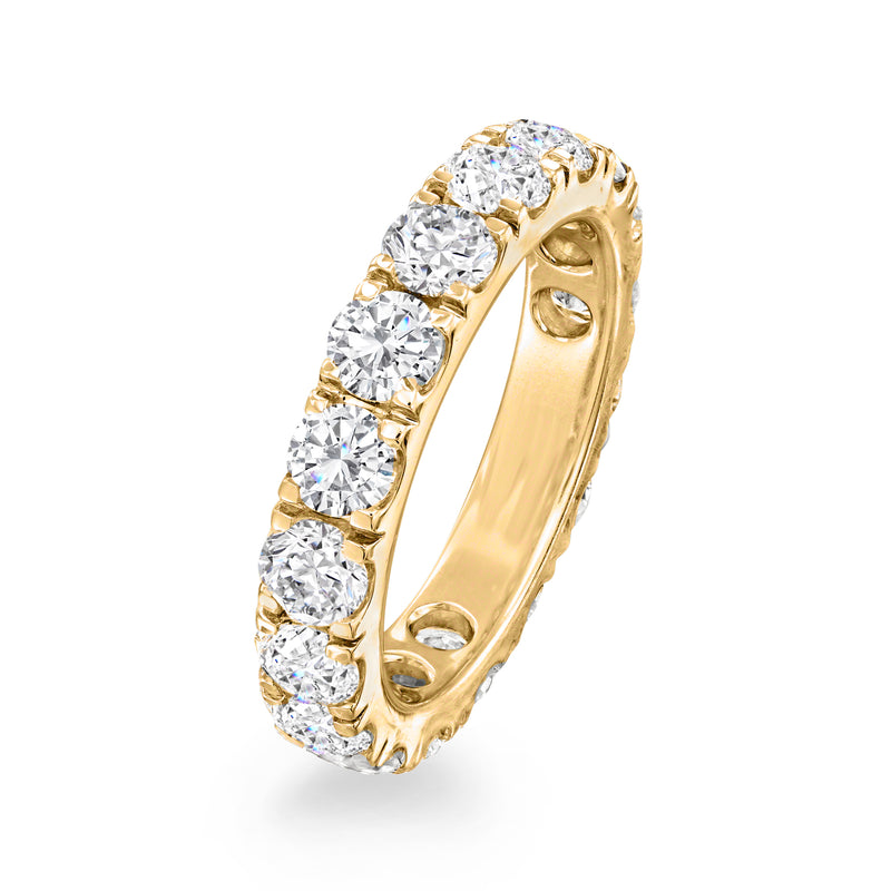 14kt yellow gold diamond eternity band with round stones, angled side view