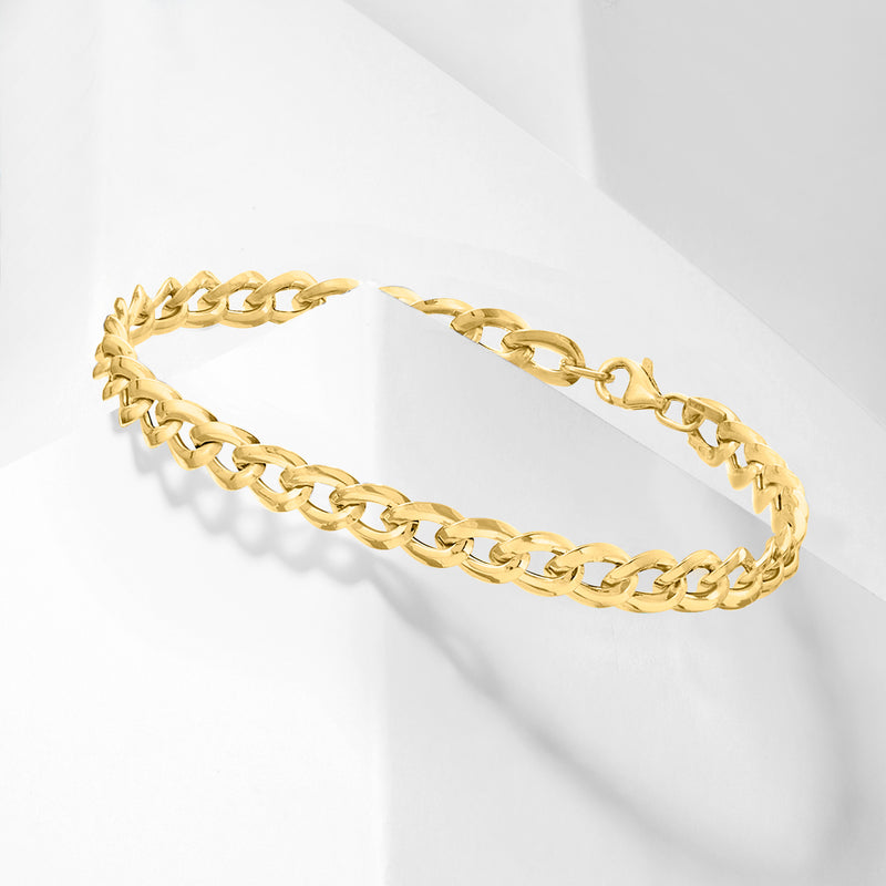 Yellow gold curb-link bracelet viewed from side, showing chain links