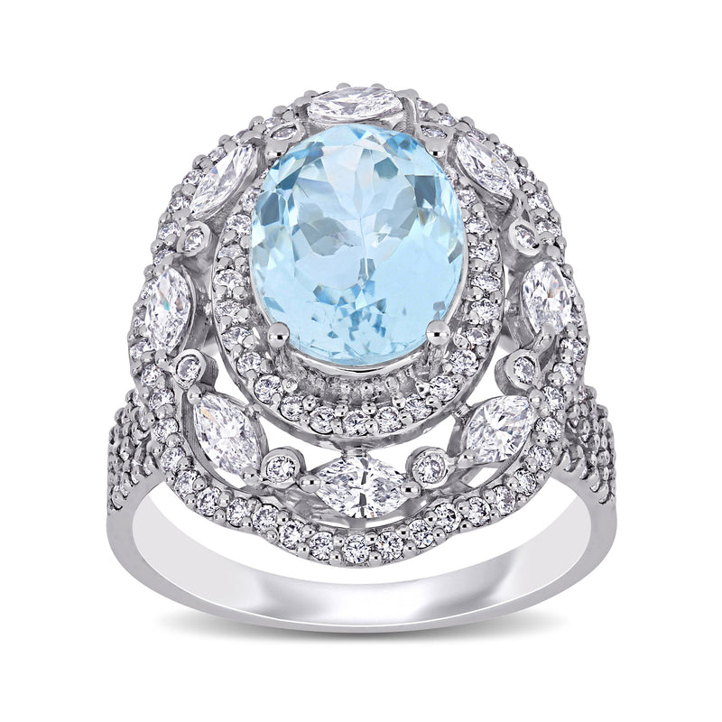 Aquamarine and diamond ring in 14kt white gold, oval blue center with diamond halo