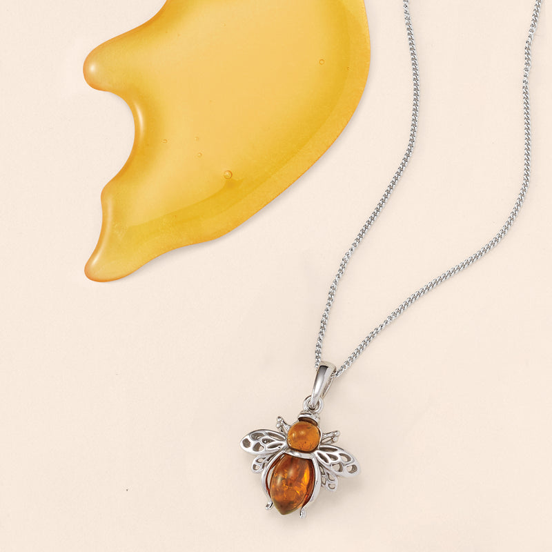 Sterling silver amber bumblebee pendant necklace with orange teardrop amber drop