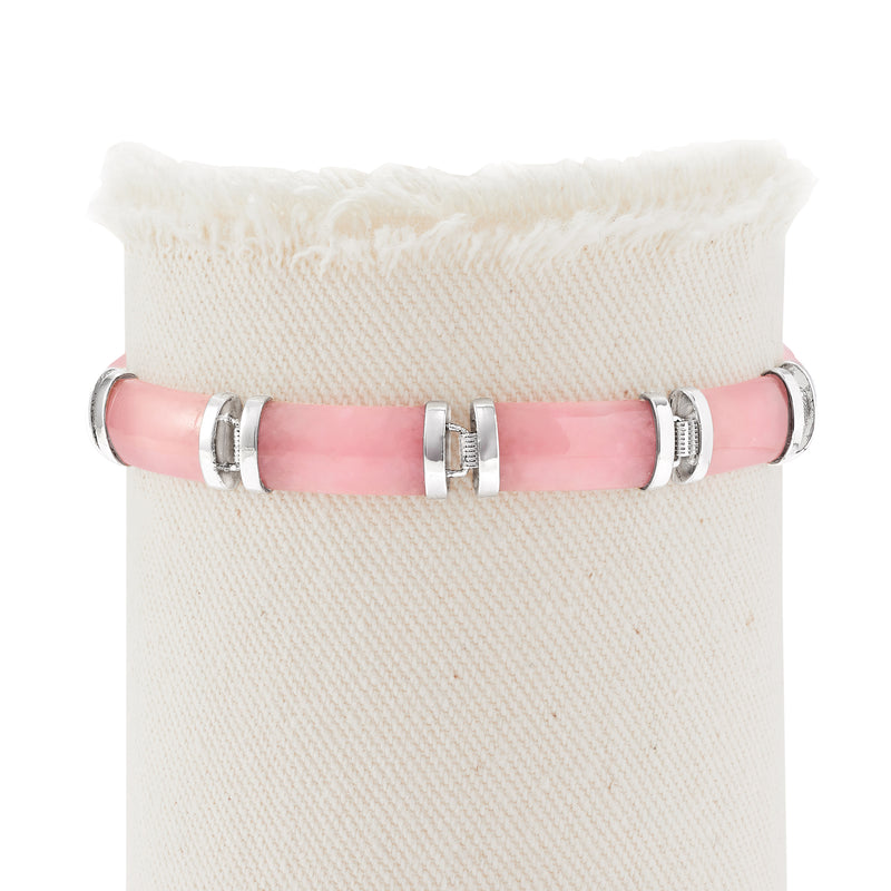 Sterling silver bracelet featuring pink jade segments with hinged clasp and links