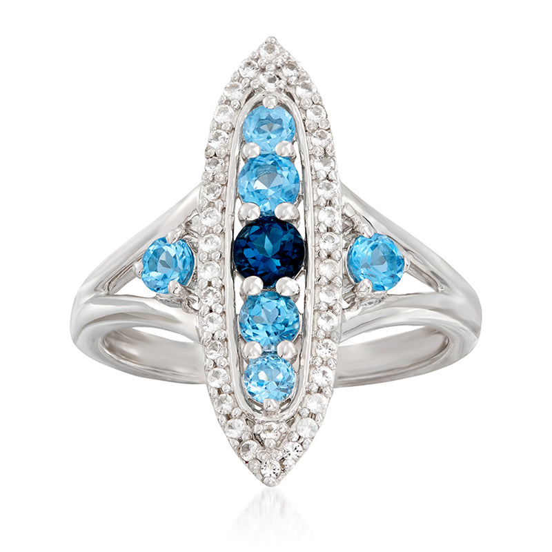 Sterling silver ring with oval blue topaz center and white topaz halo stones
