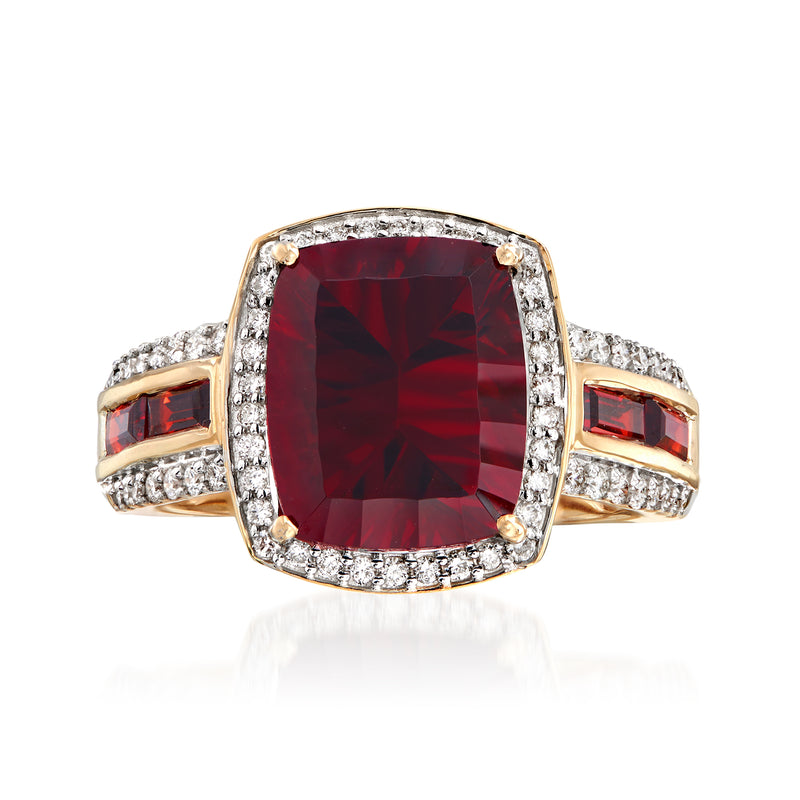 14kt yellow gold ring, cushion red garnet with diamond halo and side stones