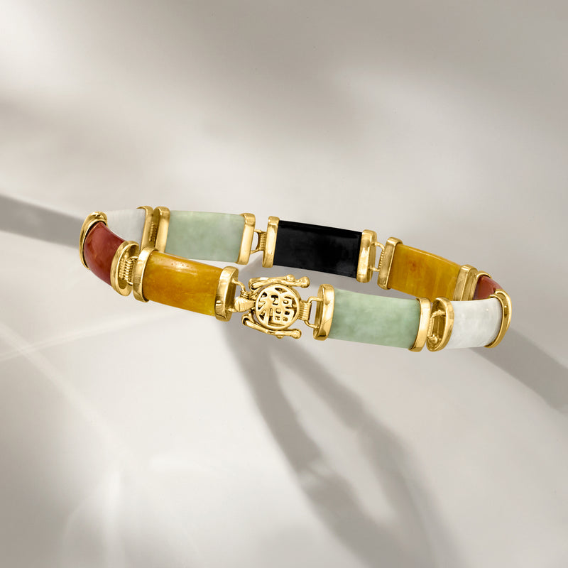 Multicolored jade bracelet with orange, green and black stone segments, gold clasp and charm