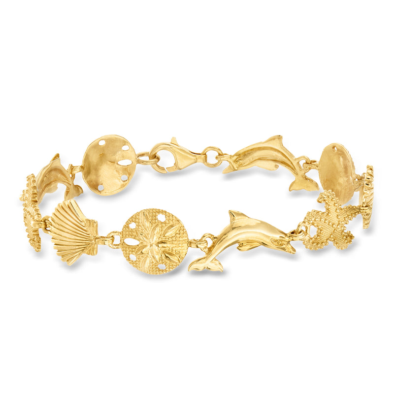 Gold over sterling sea life charm bracelet with shell and dolphin links