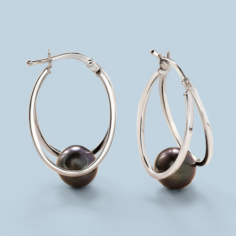 Sterling silver double-hoop earrings with dark cultured pearl drops, side view
