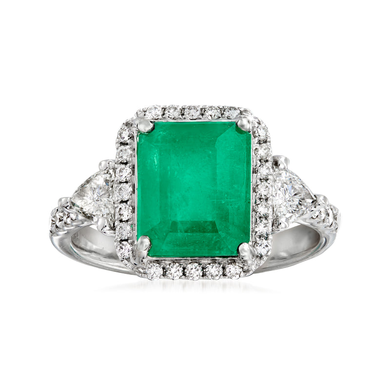 Emerald and diamond ring in 18k white gold with green center stone and diamond halo
