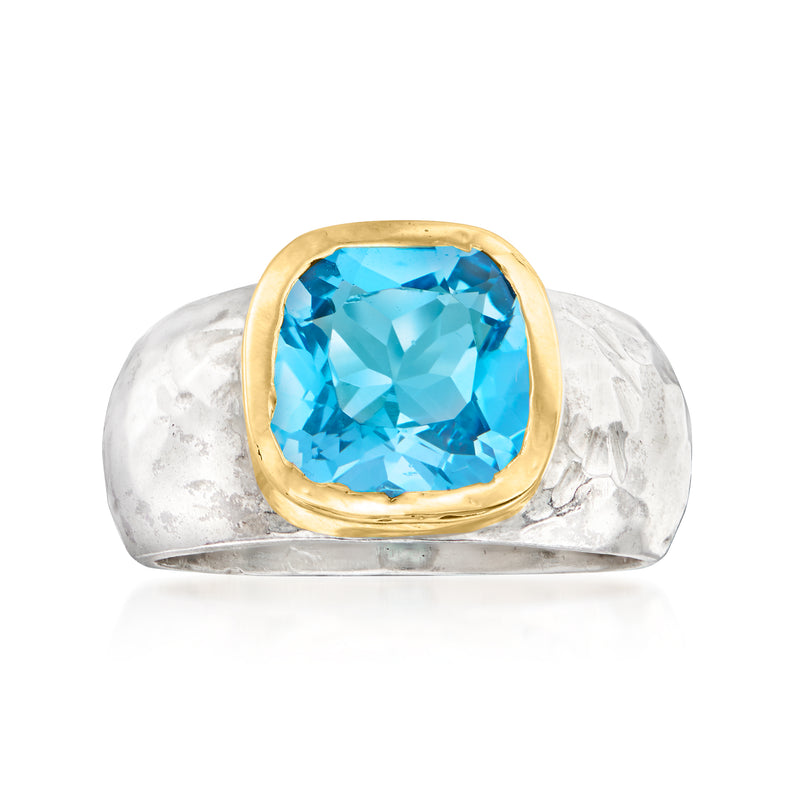 Swiss blue topaz ring with cushion-cut blue gemstone, yellow-gold bezel, sterling silver band