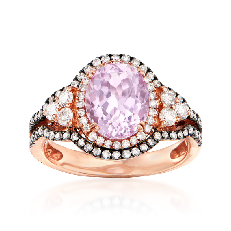 Oval pink kunzite center in rose gold ring with diamond halo and side stones