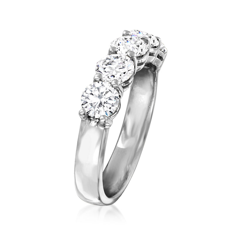 Round five-stone diamond ring in white gold, angled view of stones and band