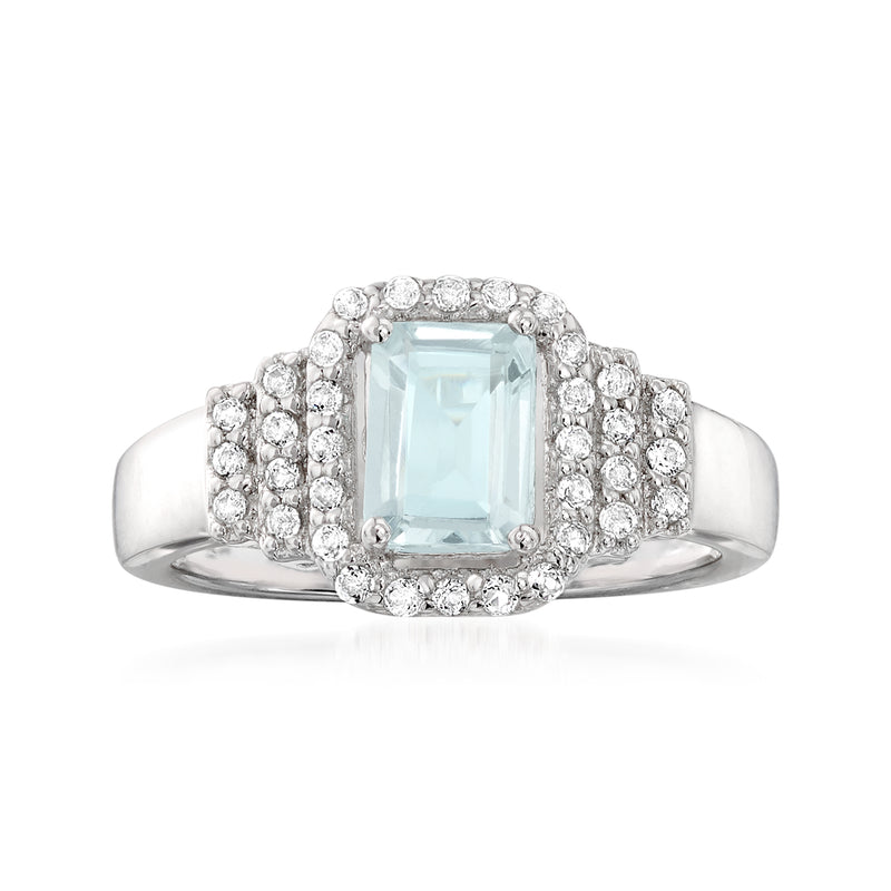 Sterling silver ring with light blue aquamarine center and white topaz halo accents
