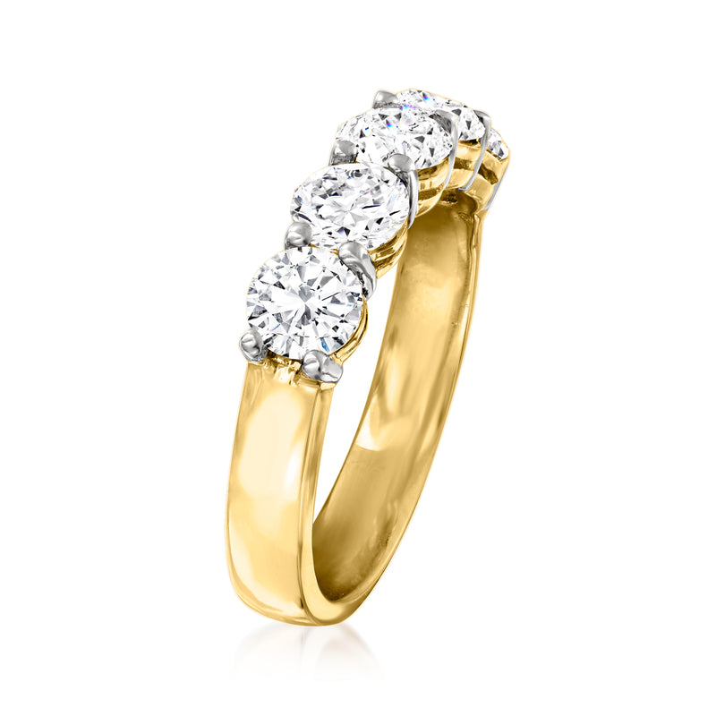Five-stone diamond ring in 14kt yellow gold, side view with raised round bezel-set stones