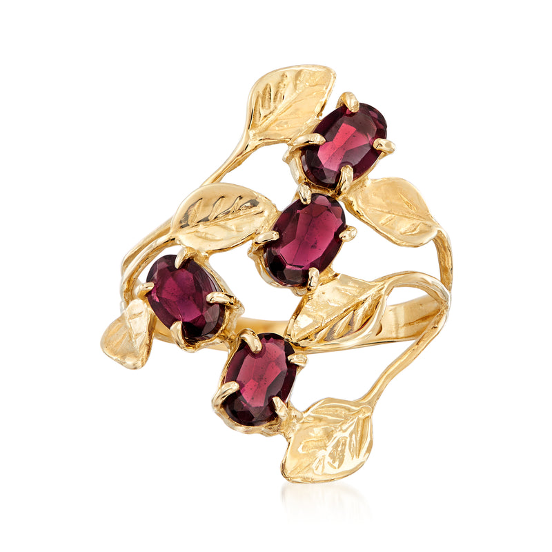 14kt yellow gold openwork leaf ring with three dark red garnet gemstones