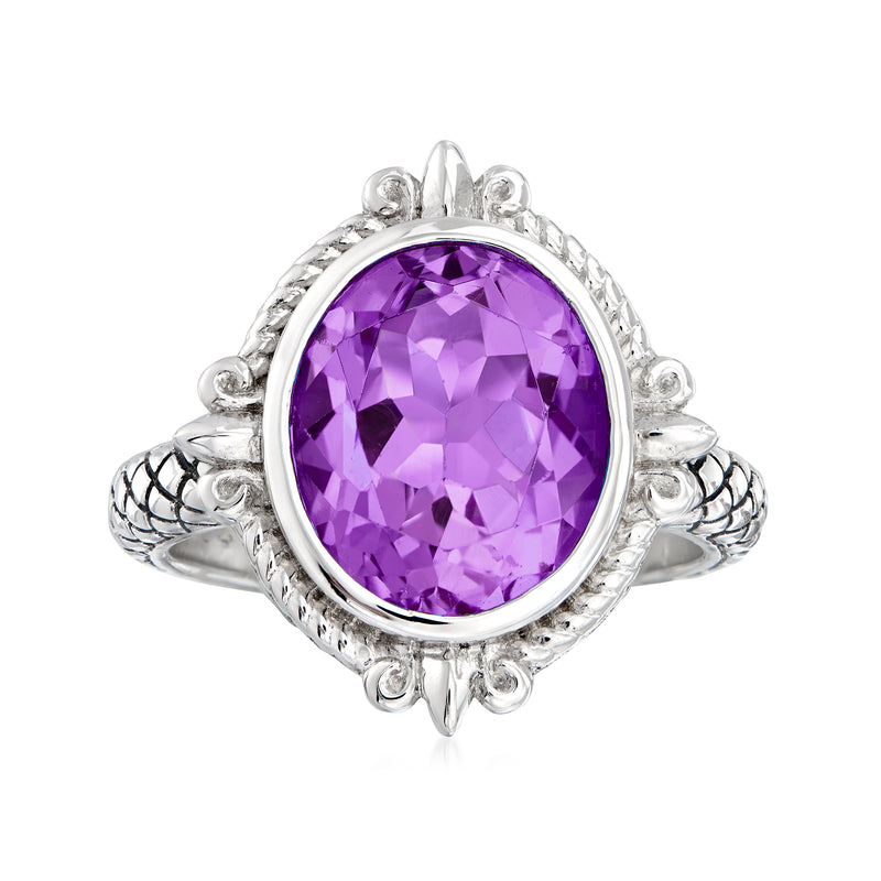 Sterling silver amethyst ring with oval purple gemstone and ornate halo setting