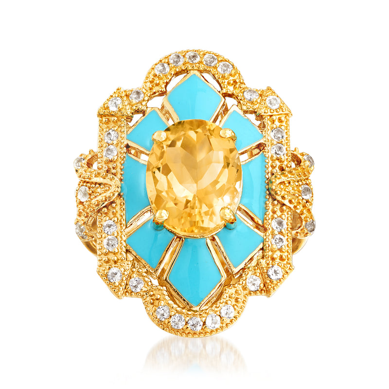 Gold ring with oval citrine center, blue enamel accents, and white topaz halo