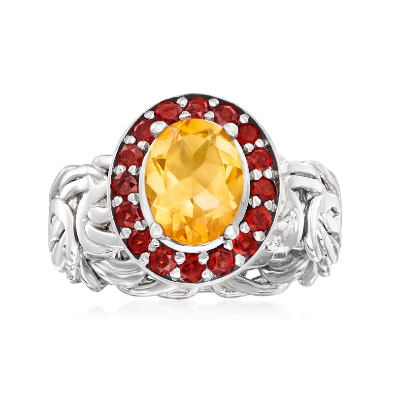 Sterling silver Byzantine ring with oval citrine center and red garnet halo, braided band