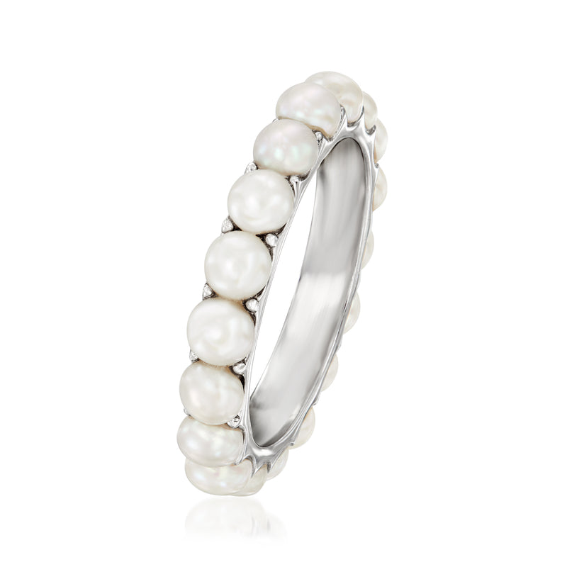 Sterling silver eternity band with white cultured pearls, angled side view