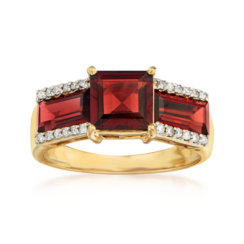 14kt yellow gold garnet and diamond ring with red square center stone and side diamonds