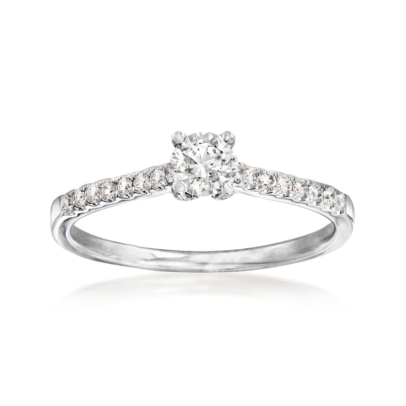 14kt white gold diamond engagement ring with round center stone and pave side band
