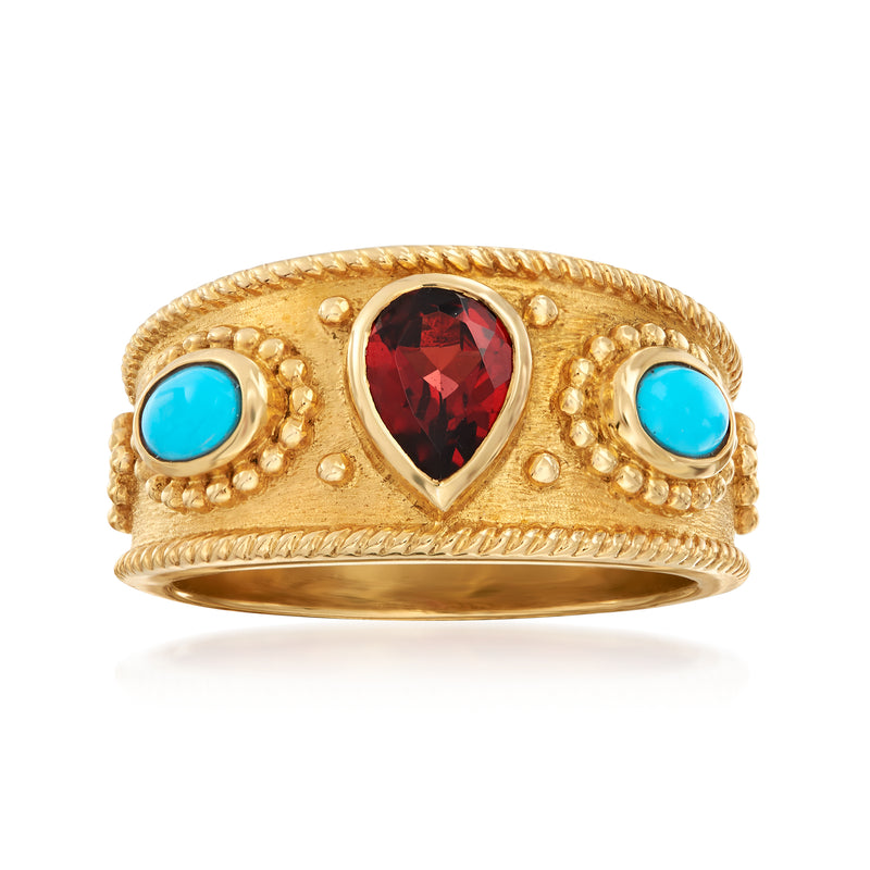 18kt gold over sterling ring with garnet teardrop center and two turquoise side stones