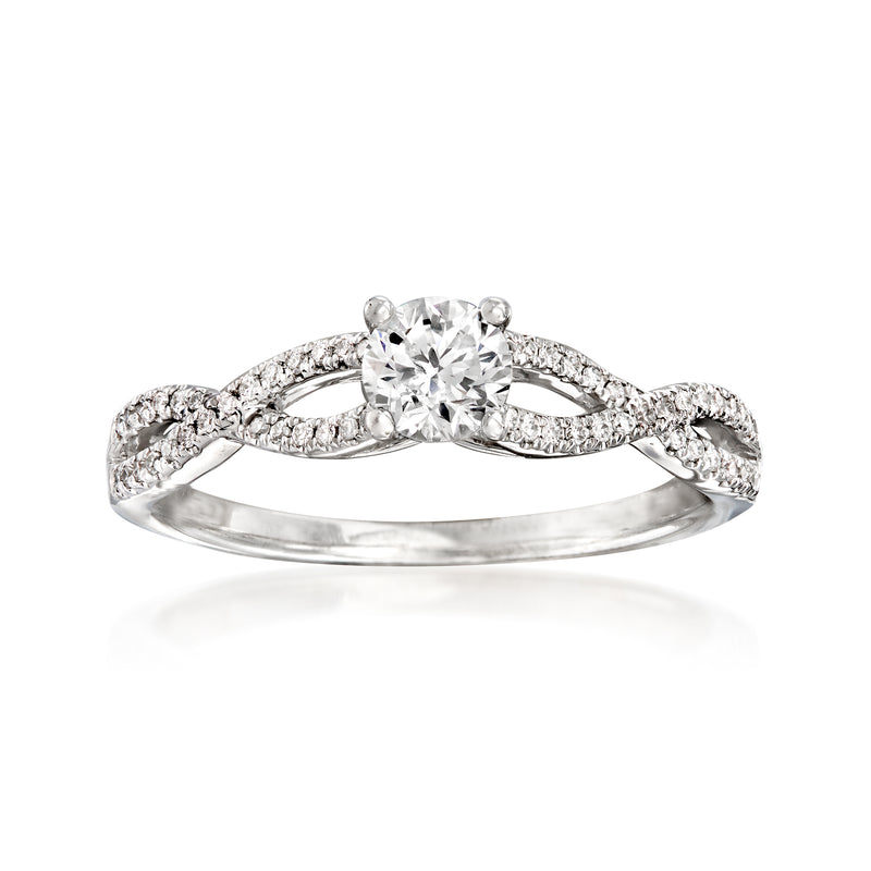 Diamond twisted engagement ring in 14kt white gold with round center stone