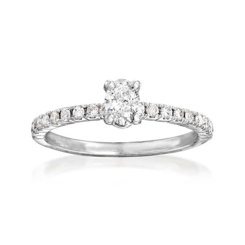 14kt white gold diamond engagement ring with round center stone and pave band