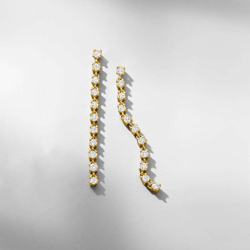 Gold linear drop earrings with round sparkling stones along curved drop, 18kt gold over sterling