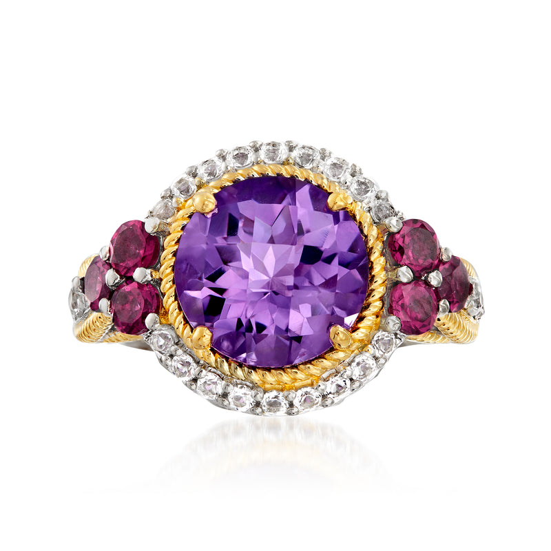 Two-tone sterling silver ring with large purple gemstone center and red side stones