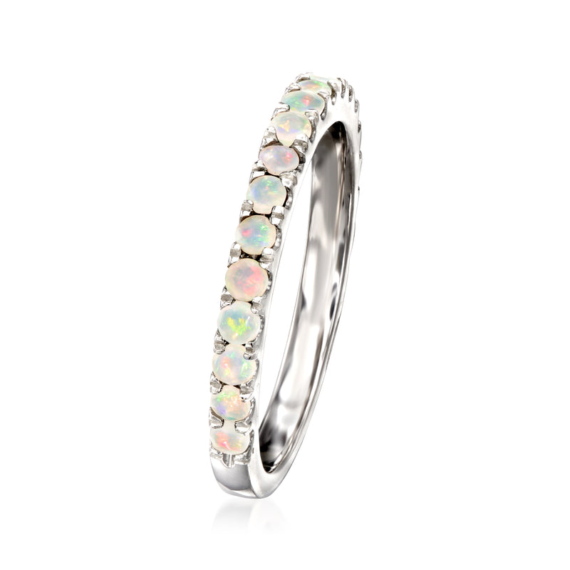Sterling silver opal ring with prong-set round opal stones along the band