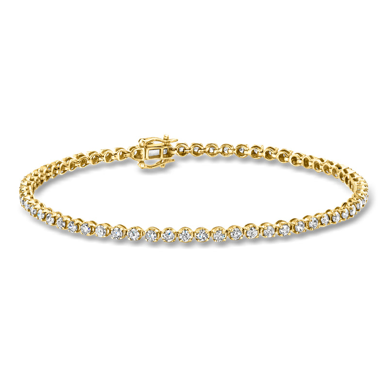 Yellow gold tennis bracelet with round diamond accents along the length