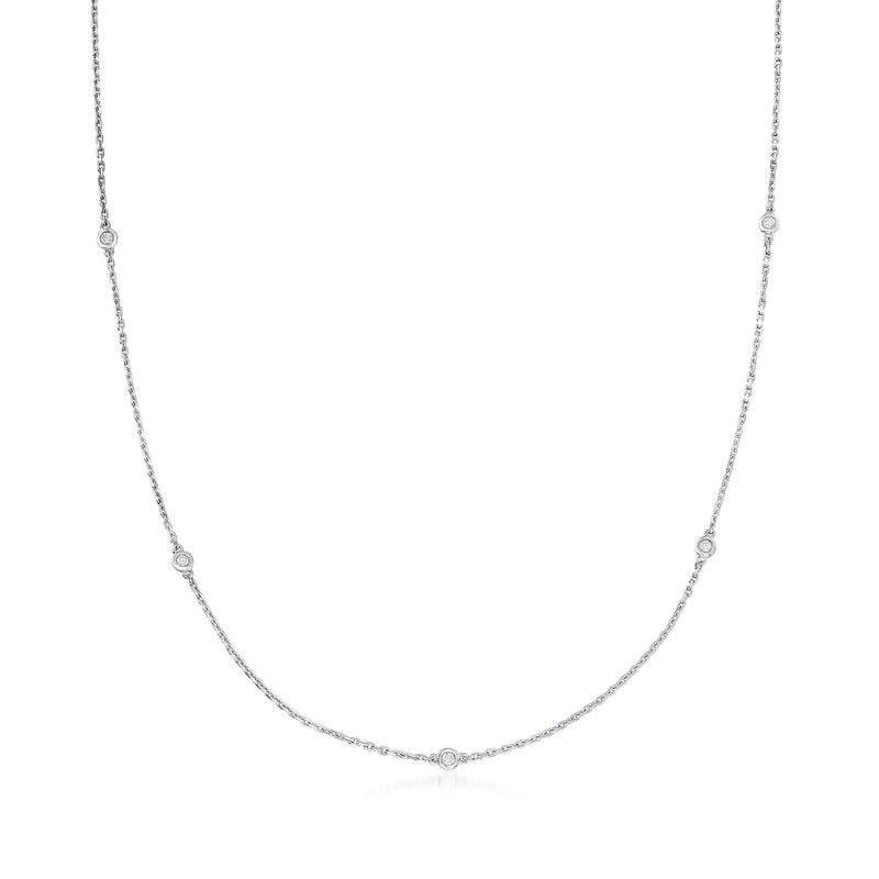 Sterling silver diamond station necklace with bezel-set round stones along the chain
