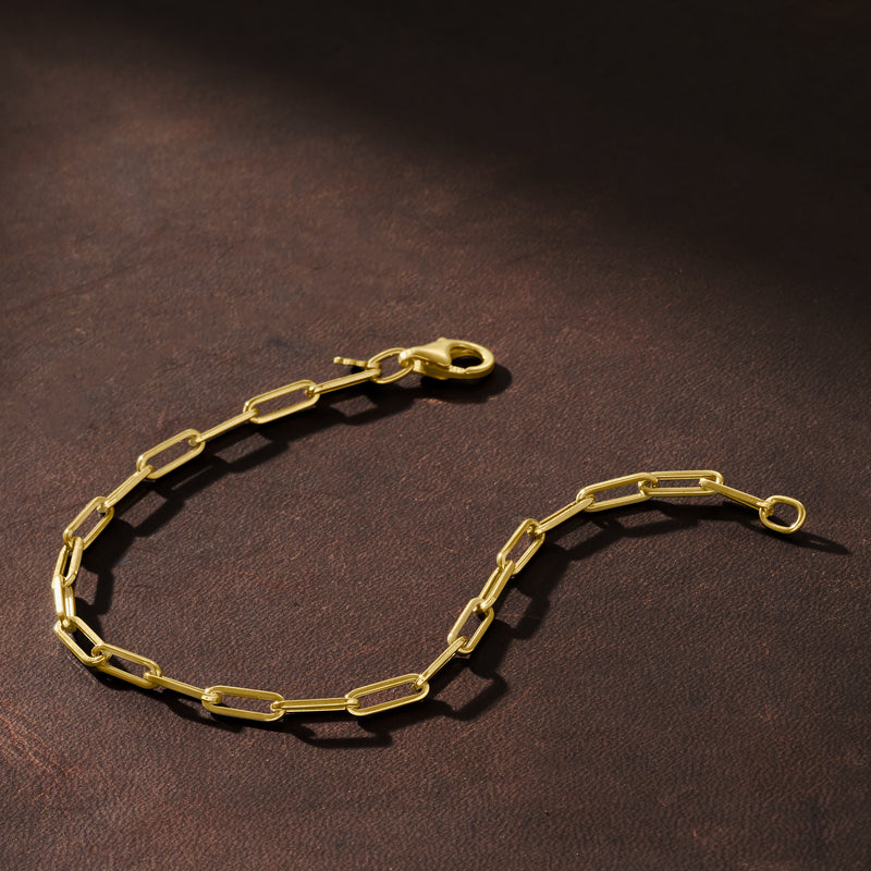 Yellow gold paper clip link bracelet with box clasp, close-up side view