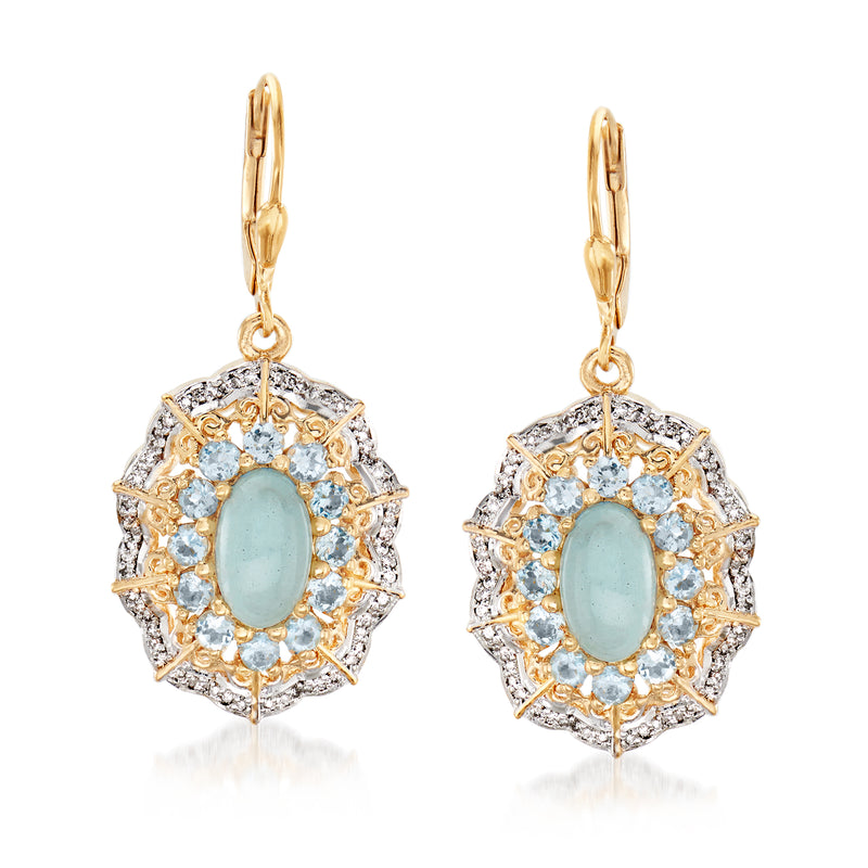 Gold leverback drop earrings with oval aquamarine center, blue stone halo and diamond accents