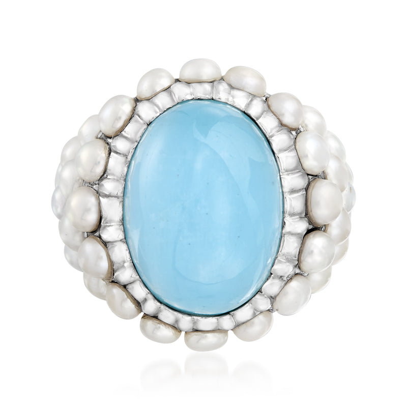 Sterling silver ring with oval aquamarine center and surrounding cultured pearls
