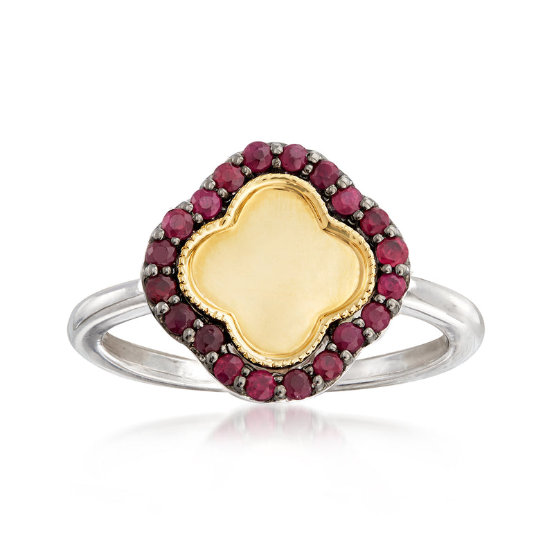 Sterling silver ring with clover-shaped red gemstone border and yellow gold center