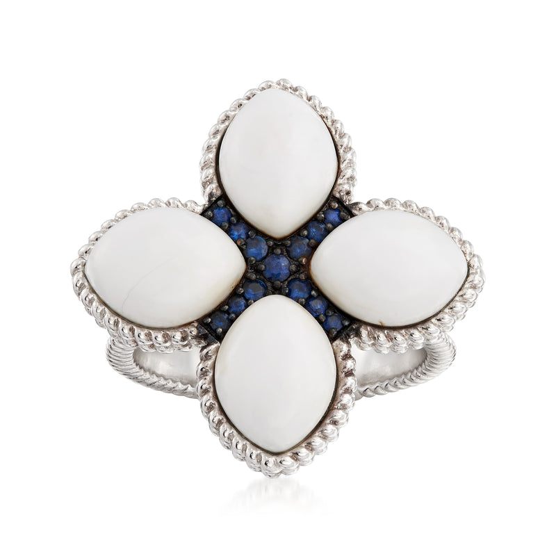 Sterling silver flower ring with four oval white stones and blue center accents