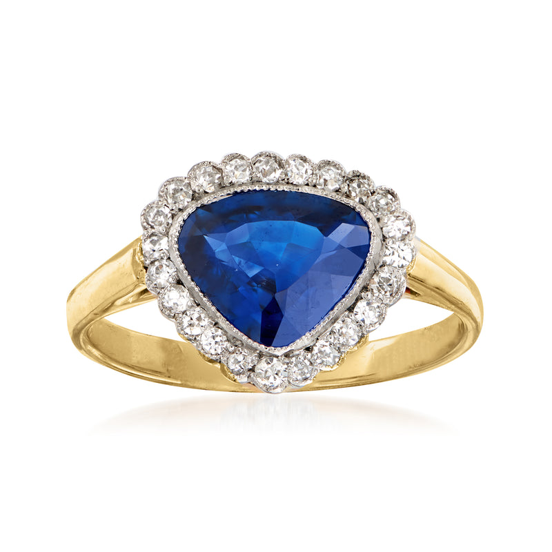 Vintage 14kt yellow gold ring with deep blue pear-shaped sapphire and diamond halo