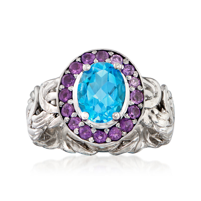 Sterling silver ring with oval Swiss blue topaz center and purple amethyst halo