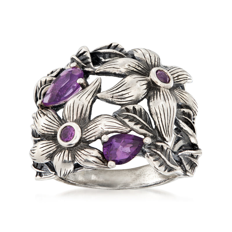 Sterling silver amethyst flower ring with openwork leaf design and three purple stones