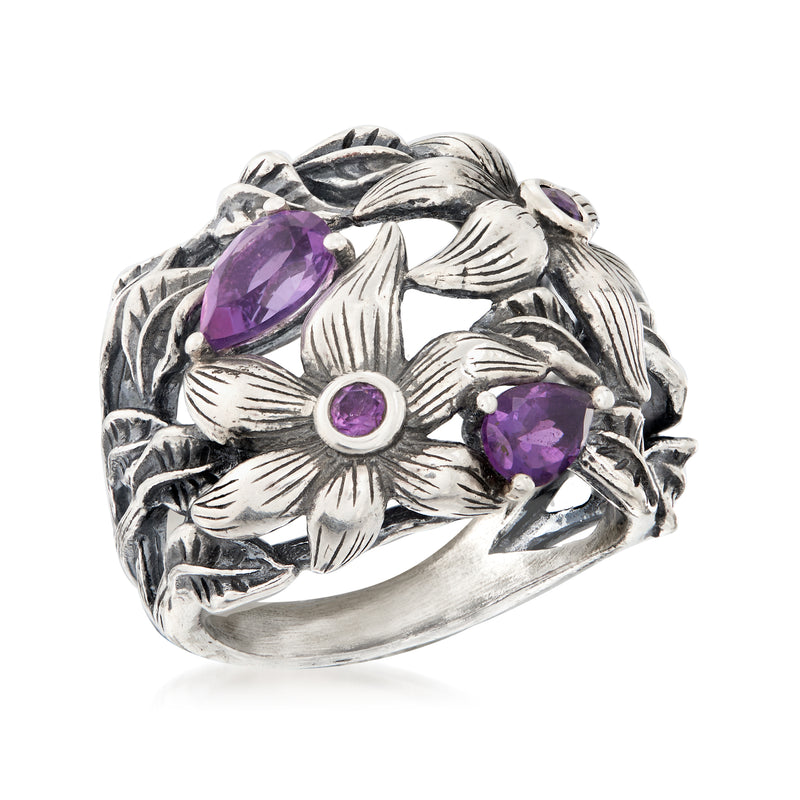 Sterling silver amethyst flower ring with central round purple stone and petals