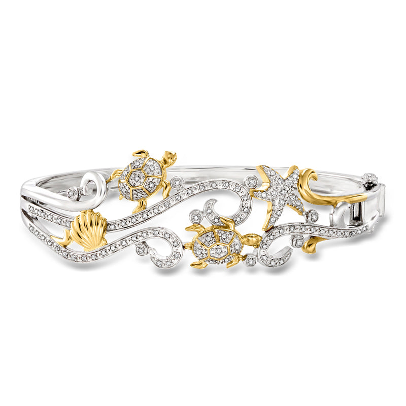 Sterling silver bangle bracelet with gold over silver sea-life charms and diamond accents